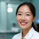 Dr. Olivia Chen smiling in clinic